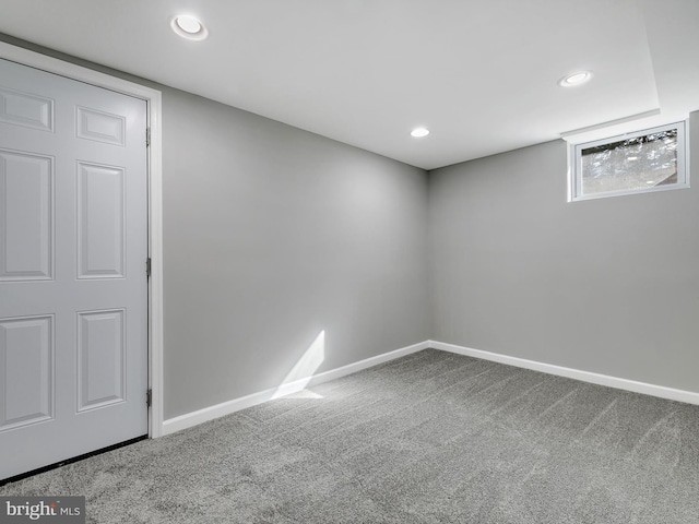 below grade area featuring carpet floors, recessed lighting, and baseboards