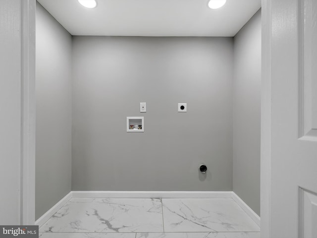 laundry room featuring laundry area, baseboards, marble finish floor, hookup for an electric dryer, and washer hookup