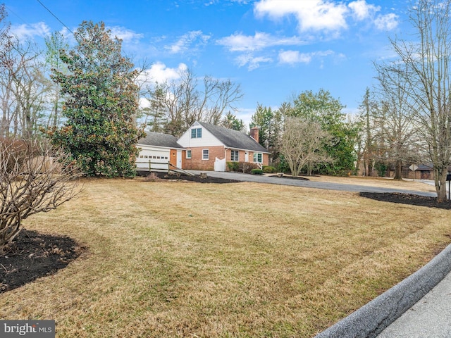 view of front of house featuring a front yard and a chimney