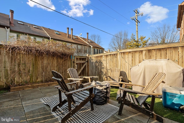 view of patio / terrace with a fenced backyard and a gate