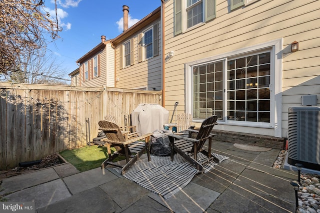 view of patio / terrace featuring central AC and fence