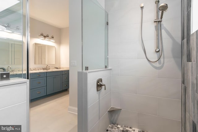 full bath with vanity and walk in shower