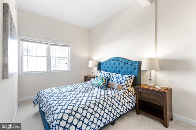 carpeted bedroom featuring baseboards