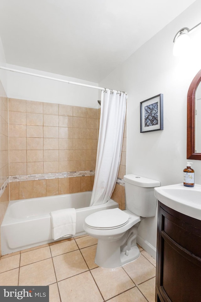 full bathroom featuring vanity, tile patterned flooring, toilet, and shower / bathtub combination with curtain