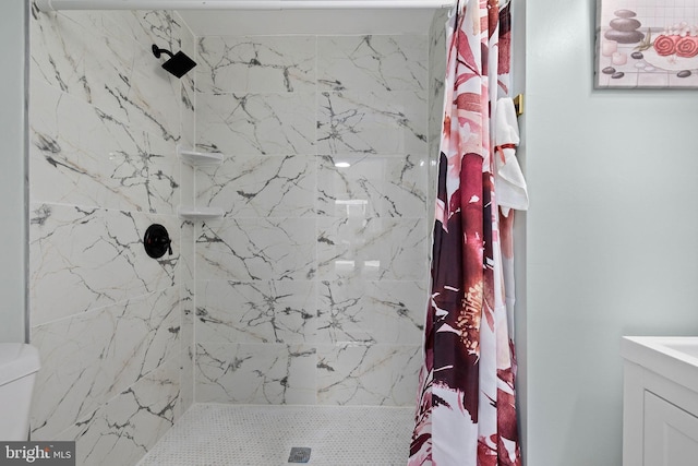 bathroom featuring a shower stall and vanity