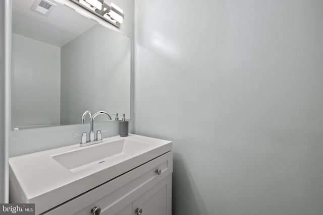 bathroom featuring vanity and visible vents