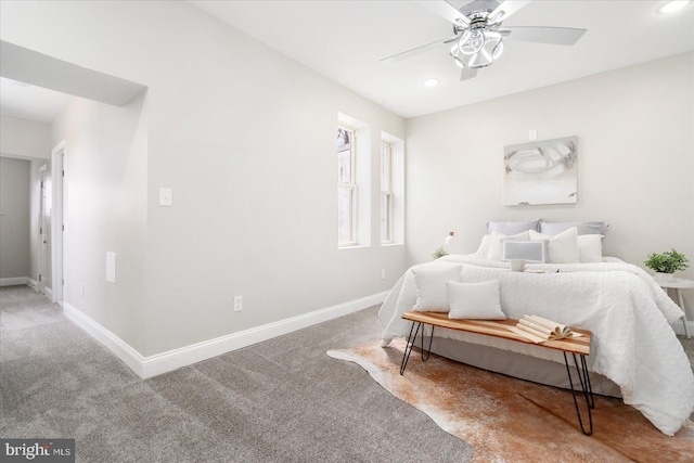 carpeted bedroom featuring ceiling fan, recessed lighting, and baseboards