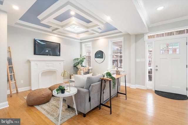 entryway featuring light wood-style floors, coffered ceiling, ornamental molding, and baseboards