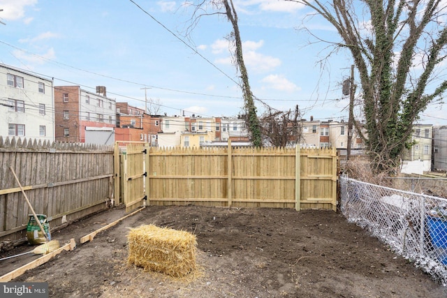 view of yard with a residential view and a fenced backyard