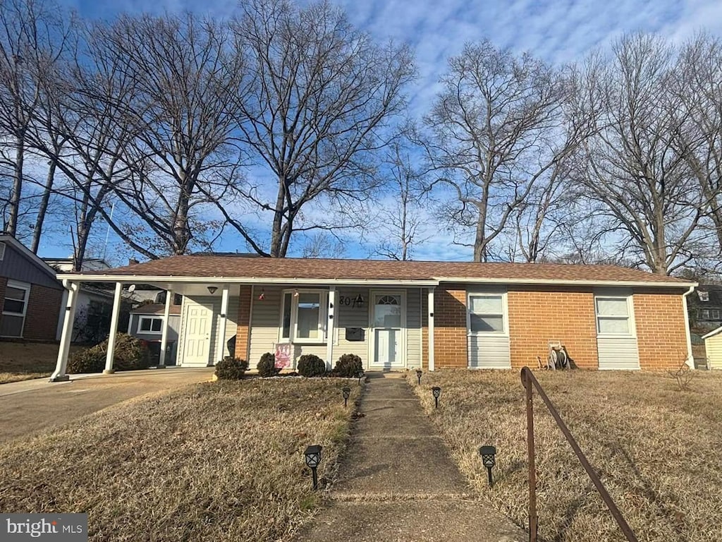 ranch-style home with brick siding and a porch