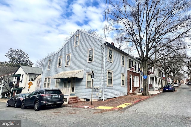 view of front of home with a chimney