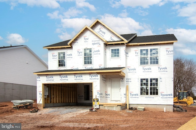 unfinished property with an attached garage