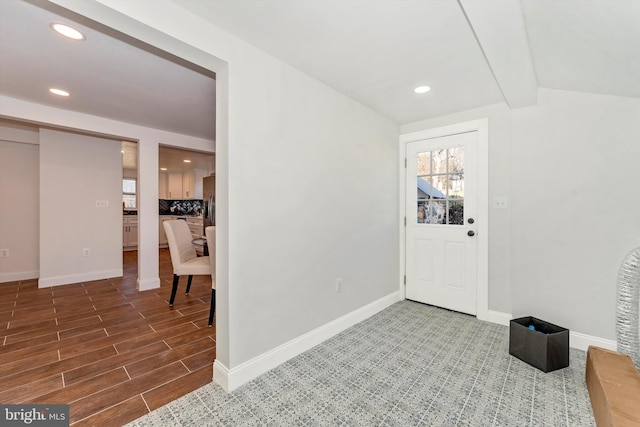 foyer featuring recessed lighting, baseboards, and wood finished floors