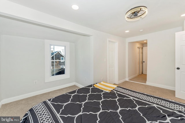 bedroom with light carpet, recessed lighting, and baseboards