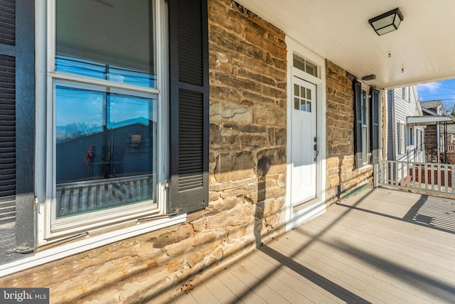 exterior space with stone siding and brick siding