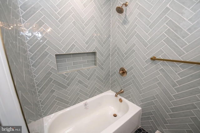 bathroom with shower / tub combination and tile walls