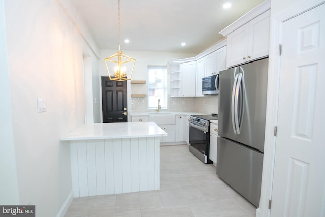 kitchen with stainless steel appliances, a peninsula, white cabinetry, backsplash, and open shelves