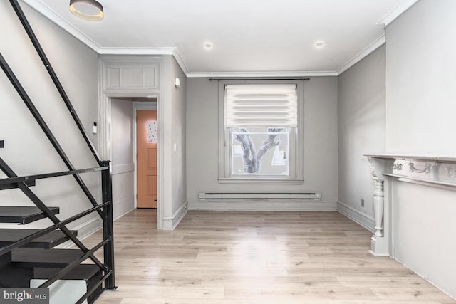 entryway featuring ornamental molding, light wood-style floors, baseboard heating, and stairs