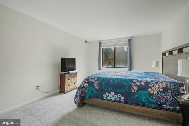 bedroom featuring carpet flooring, visible vents, and baseboards