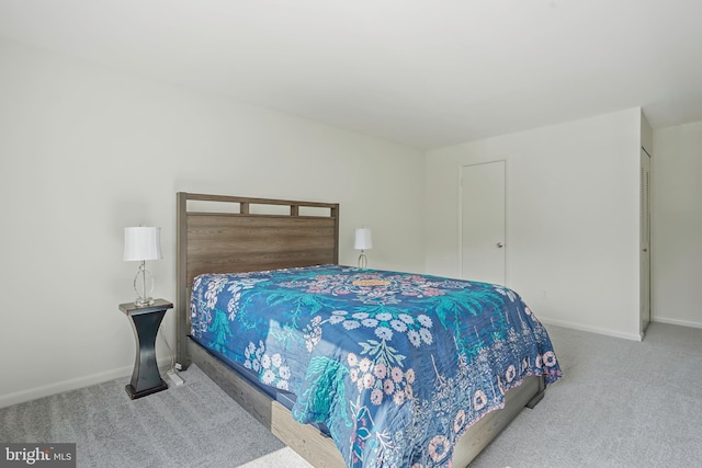 bedroom with carpet flooring and baseboards