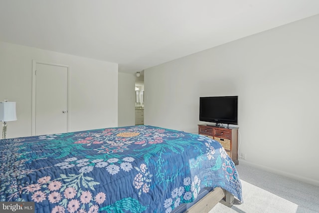 carpeted bedroom featuring baseboards