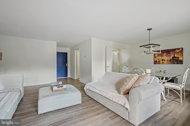 living room featuring wood finished floors and baseboards