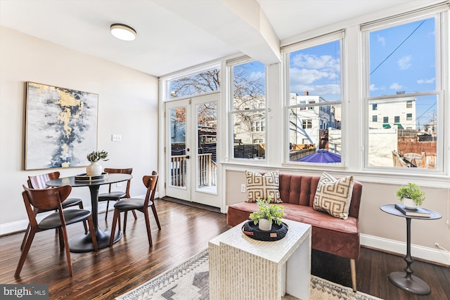 sunroom / solarium with a wealth of natural light and french doors