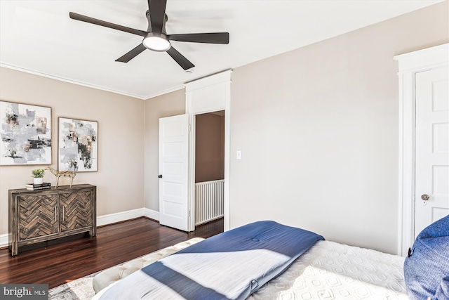 bedroom featuring ceiling fan, wood finished floors, and baseboards