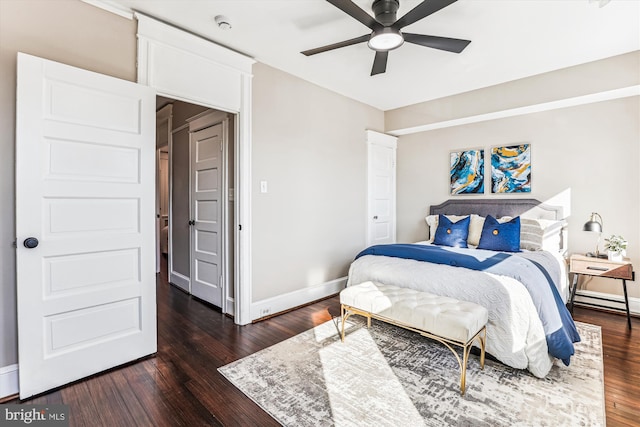 bedroom featuring dark wood finished floors, baseboards, and ceiling fan