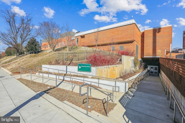 view of side of property featuring fence