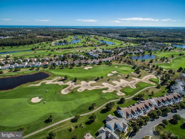 aerial view with a water view, a residential view, and golf course view