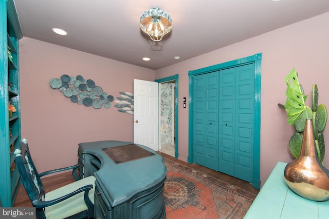 interior space featuring baseboards, wood finished floors, and recessed lighting