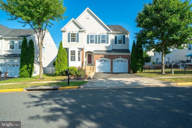 view of front of property featuring driveway, brick siding, an attached garage, and fence