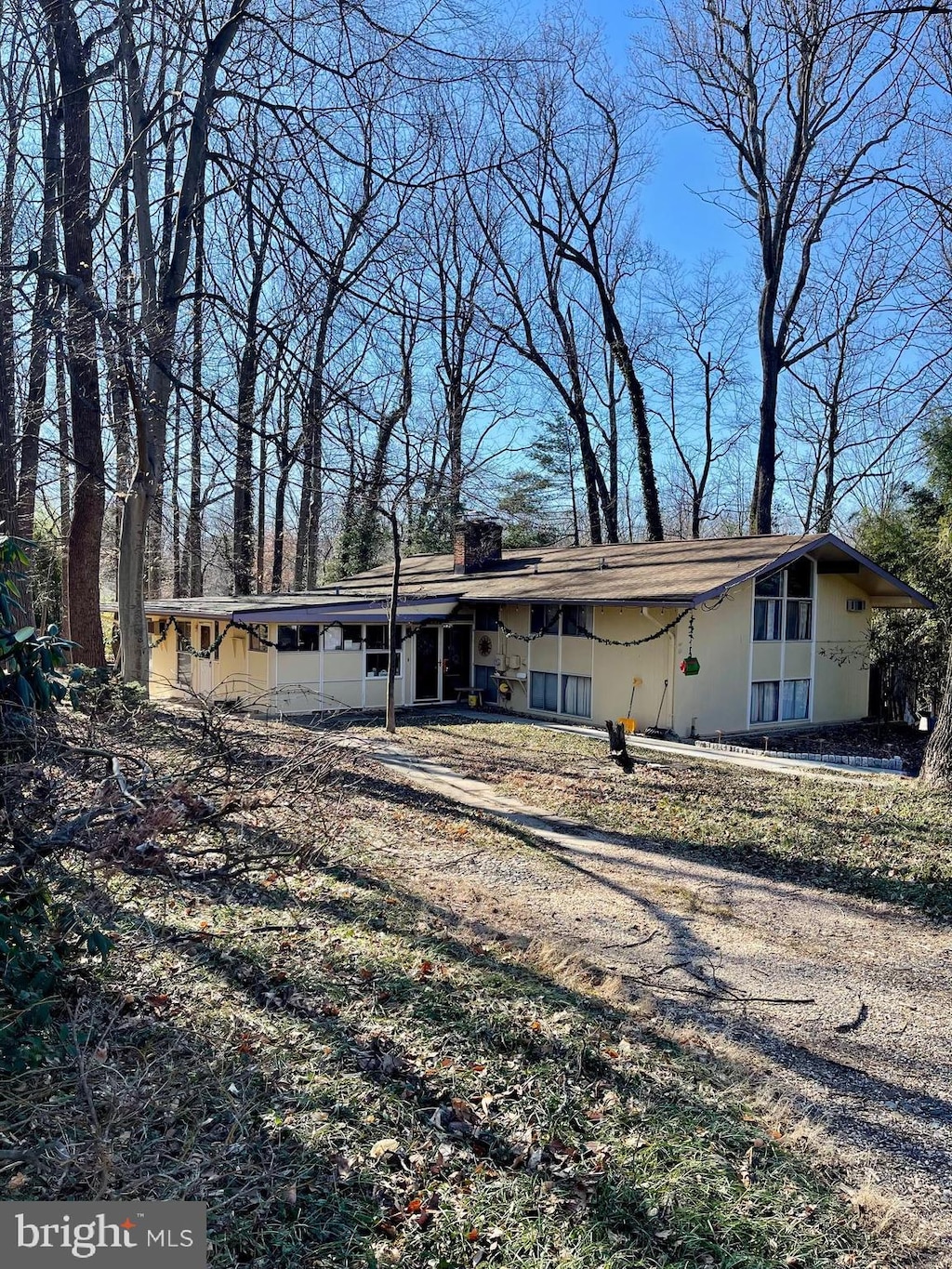 view of front of house featuring a chimney