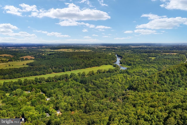 birds eye view of property with a wooded view