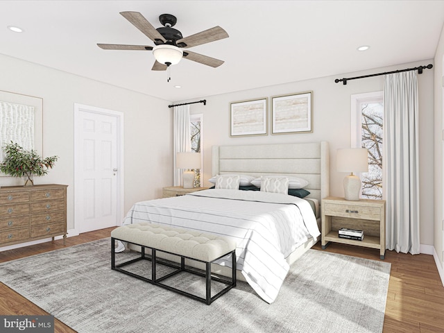 bedroom featuring baseboards, a ceiling fan, wood finished floors, and recessed lighting