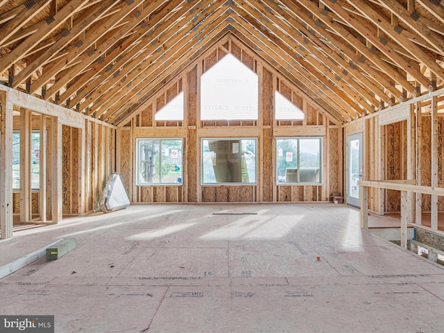 misc room with high vaulted ceiling