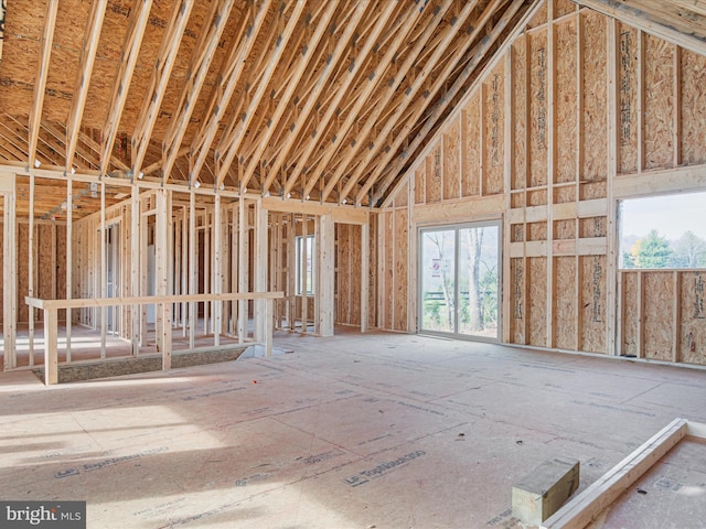 miscellaneous room featuring high vaulted ceiling