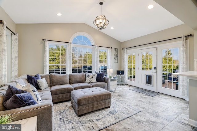 living area featuring vaulted ceiling, a notable chandelier, and recessed lighting