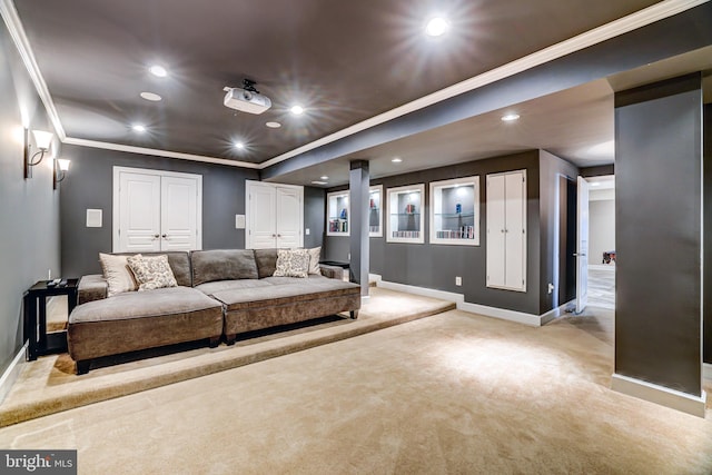 home theater with ornamental molding, recessed lighting, light colored carpet, and baseboards