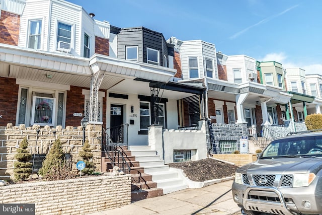 townhome / multi-family property with brick siding