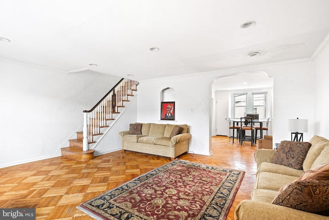 living area with arched walkways, recessed lighting, baseboards, ornamental molding, and stairway