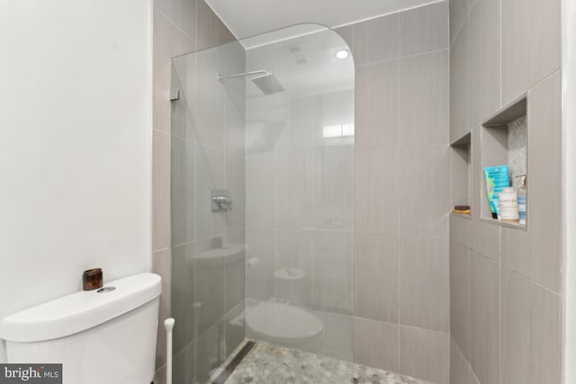 full bathroom with toilet and walk in shower