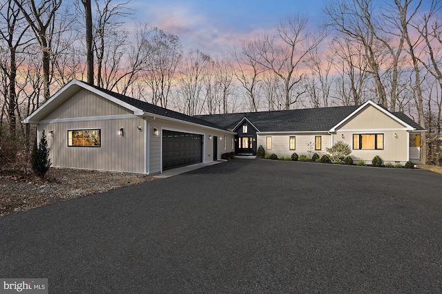 view of front of property with an attached garage and driveway