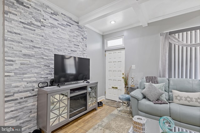 living room featuring ornamental molding, beamed ceiling, and wood finished floors