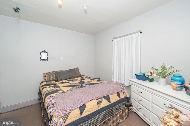 bedroom featuring wood finished floors