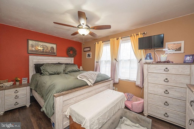 bedroom with dark wood-style floors and ceiling fan