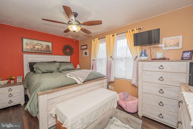 bedroom with dark wood-style flooring and a ceiling fan