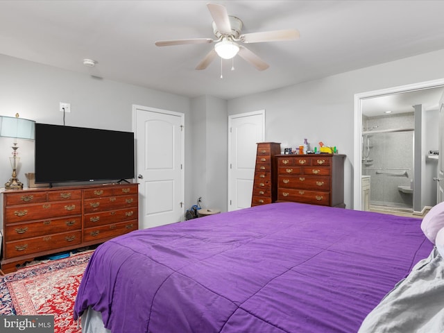 bedroom featuring ensuite bath and ceiling fan