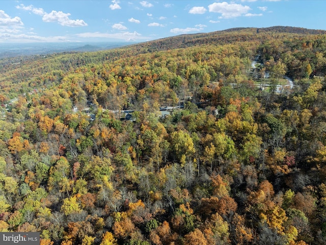 drone / aerial view featuring a forest view